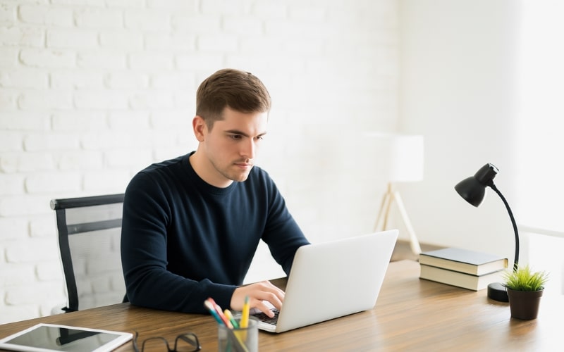 Massachusetts Real Estate Practice Exam a young man is doing Massachusetts real estate practice tests hard to get good score on the exam day